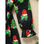 Black leggings with Christmas tree and Santa Claus pattern on a beige background