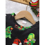 Black shirt with Christmas-themed design on a hanger