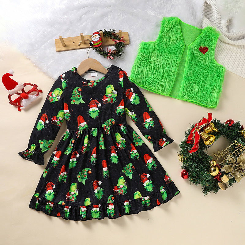 Black dress with Christmas elf pattern, green vest, and festive wreaths on a light background
